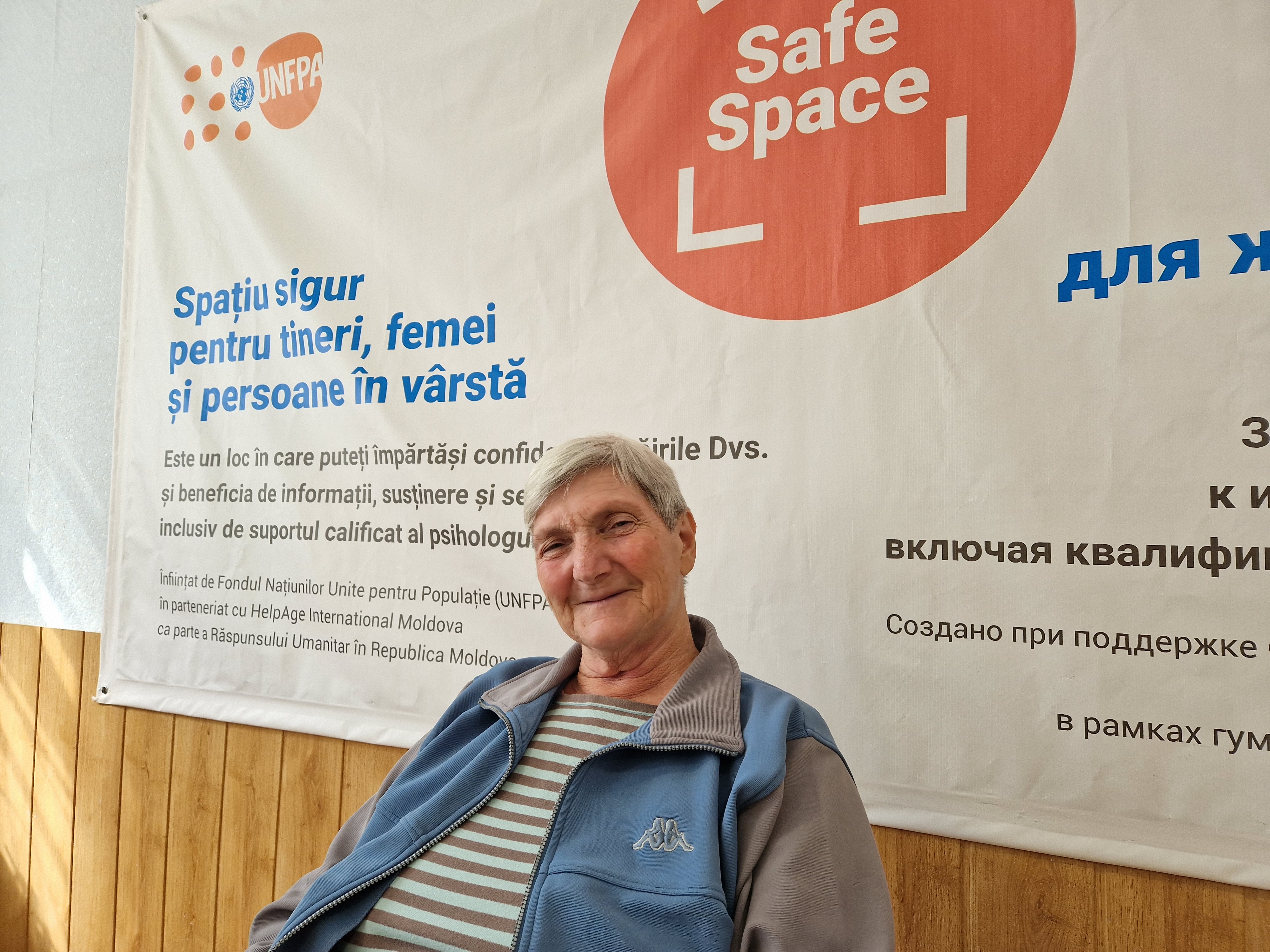 An older refugee sitting at the Safe Space