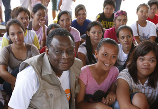 UNFPA Executive Director, Dr. Babatunde Osotimehin with young girls