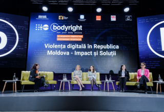 Five women sit on sofas placed on stage, discussing the first panel at the launch of the Bodyright campaign.