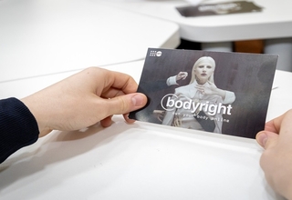 aABodyright card held by a teenager