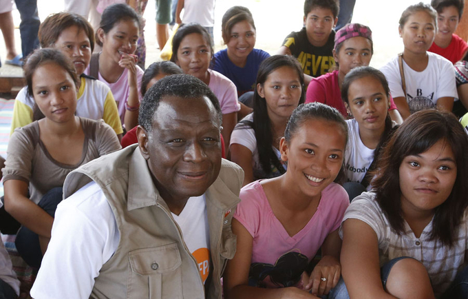 UNFPA Executive Director, Dr. Babatunde Osotimehin with young girls