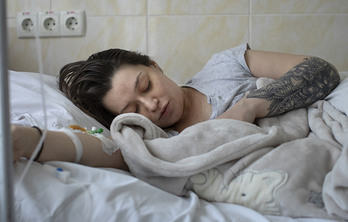 A woman is breastfeeding her newborn baby at a maternity in Chisinau, Moldova