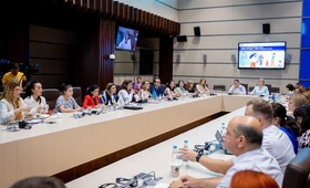 Participants at the launch of the study discussing at a round table, at the Parliament of the Republic of Moldova
