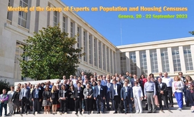 Participants of the conference posing in front of the building