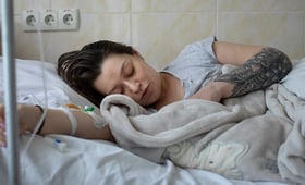 A woman is breastfeeding her newborn baby at a maternity in Chisinau, Moldova