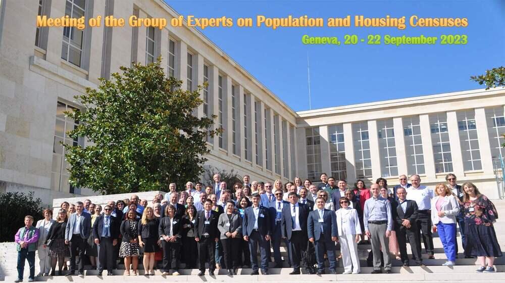 Participants of the conference posing in front of the building