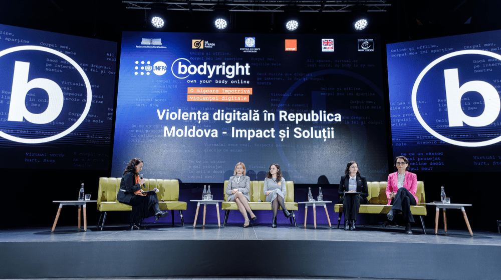 Five women sit on sofas placed on stage, discussing the first panel at the launch of the Bodyright campaign.