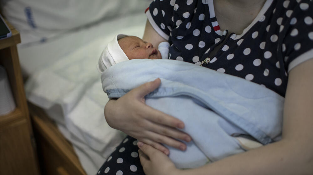 Mother holding a newborn