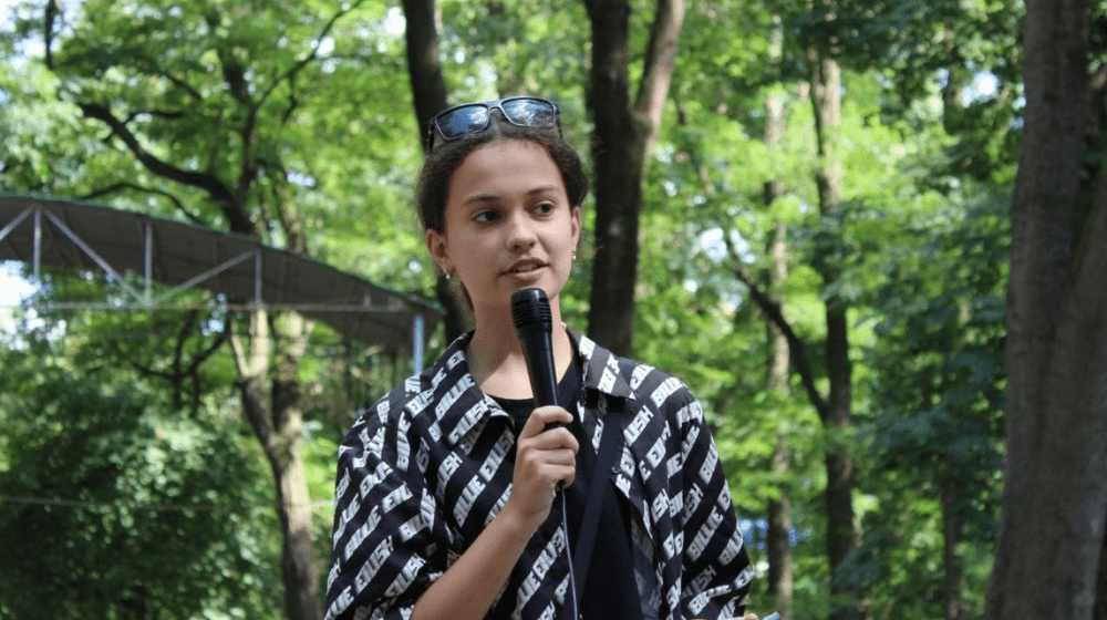 A girl who speaks at the microphone