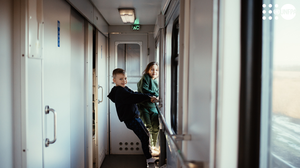 a boy and girl standing in a hallway