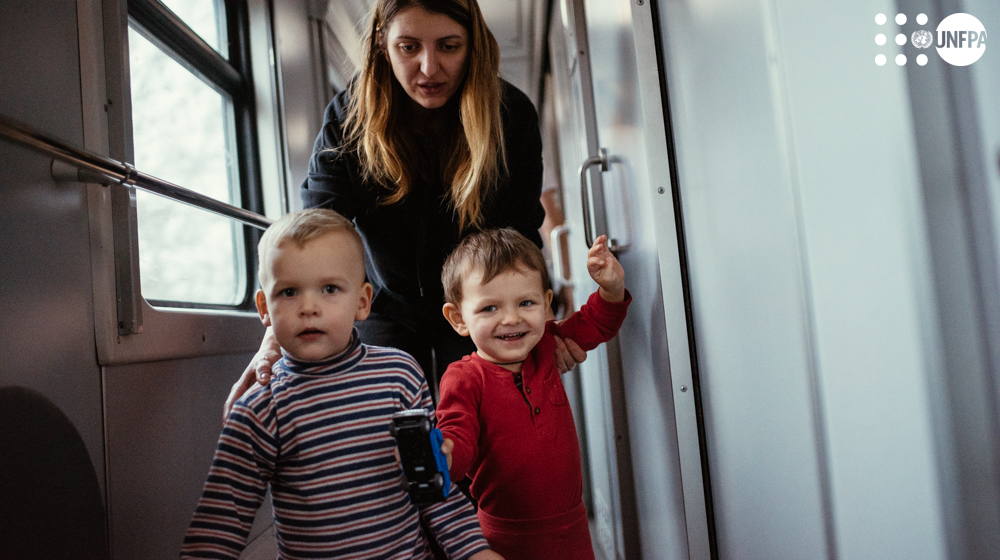 a person and two children on a train